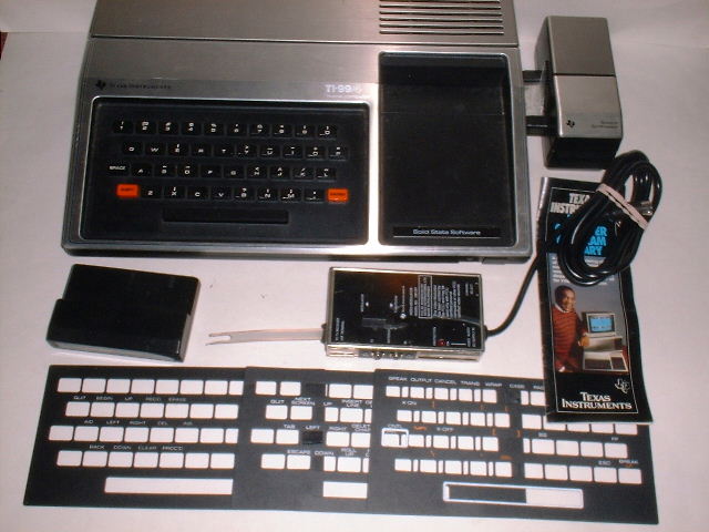 1979_TI-99-4_with_Speech_Synthesizer,_RF_modulator,_keyboard_overlays.jpg