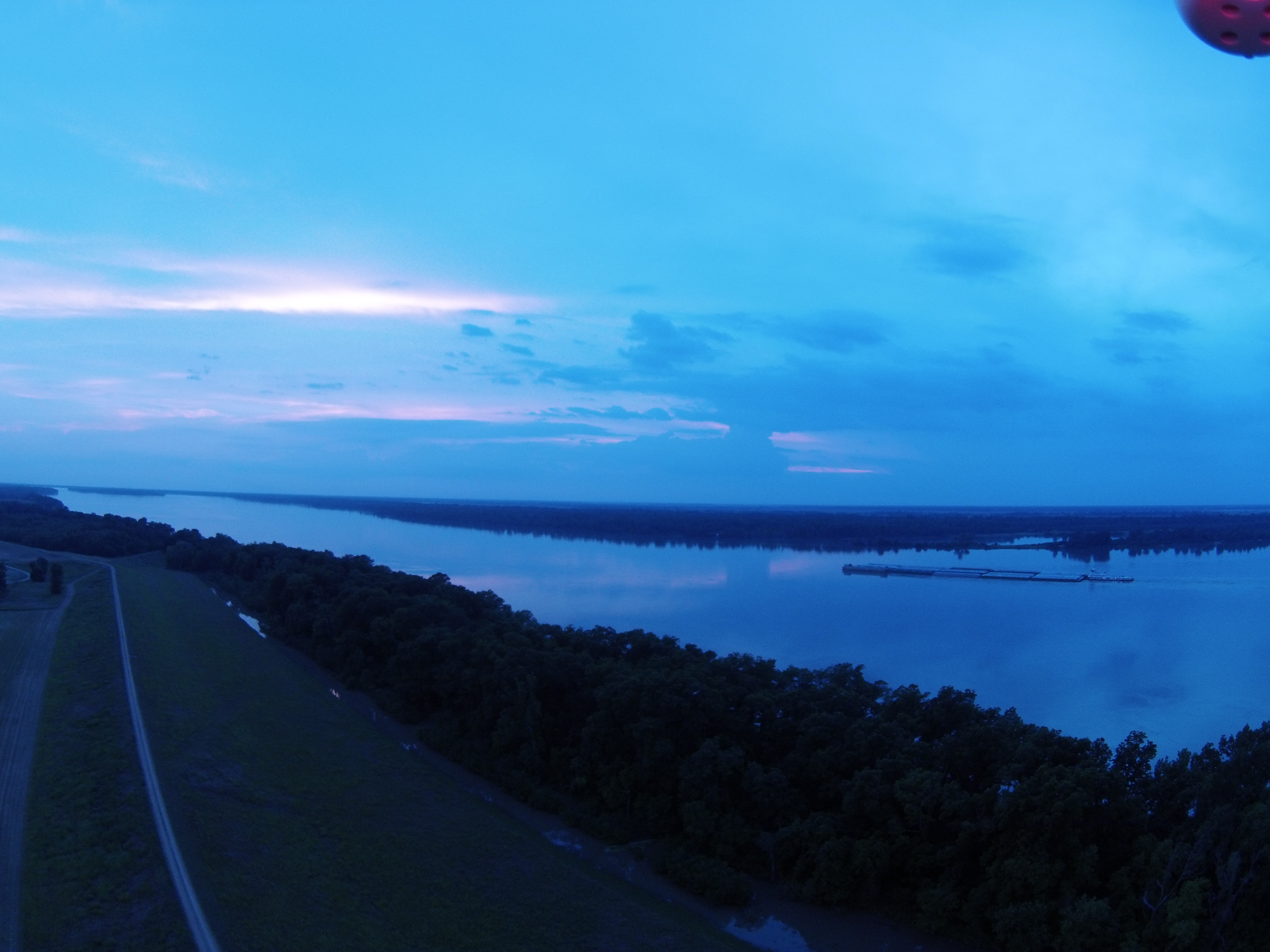 Barge headed down river sunset.jpg