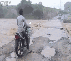 Motorcycle-river-flood.gif