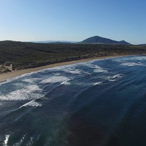 Relaxing Waves - 4K Flight over the Blue Water of the Surfer's Beach Porto Ferro, Alghero, Sardinia